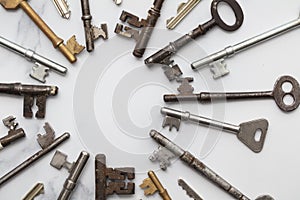 Frame of vintage keys on white background. Safety and security concept