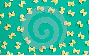 Frame from wheat pasta on green background