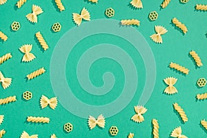 Frame from wheat pasta on green background