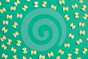 Frame from wheat pasta on green background