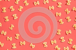 Frame from wheat pasta on red background