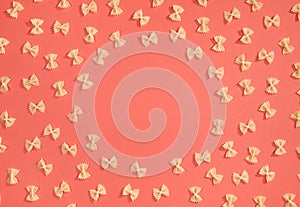 Frame from wheat pasta on red background
