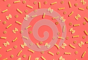 Frame from wheat pasta on red background