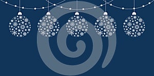 Frame of white Christmas balls with a snowflake pattern and garland on a blue background. Vector illustration