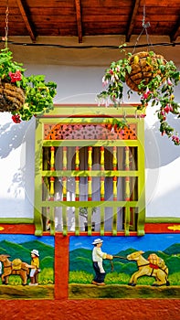 Frame of a window in the colourful house in GuatapÃÂ©, Colombia photo