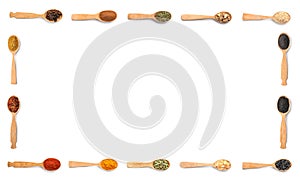 Frame of wooden spoons with different spices