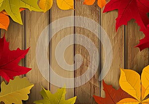 Frame from yellow autumn leaves on wooden background. Design element for poster, flyer, greeting card.