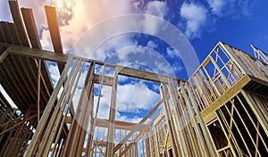 New beam construction home framing over blue sky