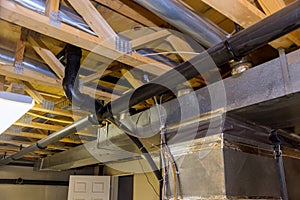 Framed home installation of air conditioner and heating ductwork in ceiling