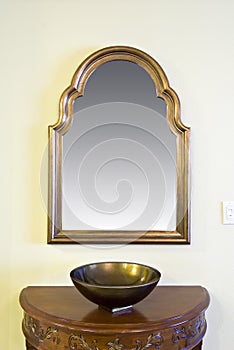 Framed mirror with decorative bowl