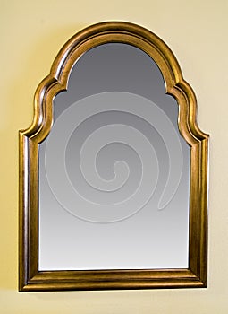 Framed mirror hanging on wall