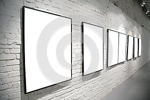 Frames on brick white wall