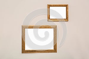 Frames with empty canvases on wall in modern art gallery