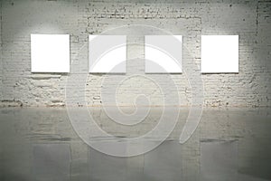 Frames on white brick wall