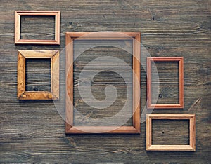 Frames on wooden wall