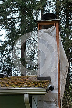 The framework of a chimney being refinished
