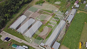 Frameworks of greenhouses, top view. Clip. Construction of greenhouses in the field. Agriculture, agrotechnics of closed photo