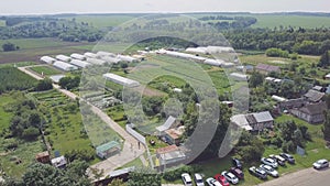 Frameworks of greenhouses, top view. Clip. Construction of greenhouses in the field. Agriculture, agrotechnics of closed