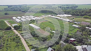 Frameworks of greenhouses, top view. Clip. Construction of greenhouses in the field. Agriculture, agrotechnics of closed