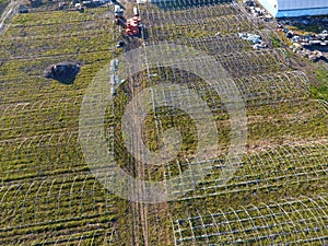 Frameworks of greenhouses, top view. Construction of greenhouses in the field. Agriculture, agrotechnics of closed ground