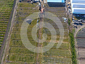 Frameworks of greenhouses, top view. Construction of greenhouses in the field. Agriculture, agrotechnics of closed ground photo