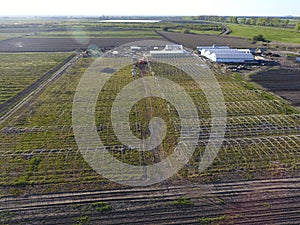 Frameworks of greenhouses, top view. Construction of greenhouses in the field. Agriculture, agrotechnics of closed ground photo