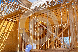 Framing beams at wooden framework construction of new house under construction a home