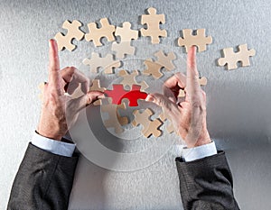 Framing businessman hands picking the odd one to link others photo