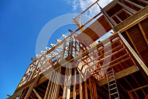 Framing of house Closeup new stick built home under construction under blue sky construction and real estate