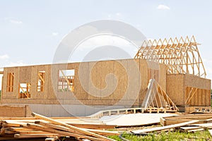 Framing of a new wooden house under construction wooden wall plywood
