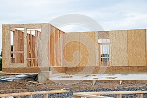 Framing of a new wooden house under construction wooden wall plywood beam residential