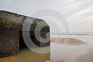 France blockhouse blockhaus in water sea on sand beach atlantic coast photo