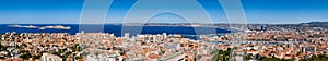 Marseille harbor. Panoramic summer view on Marseille rooftops with Vieux Port and the Mediteranean Sea. France