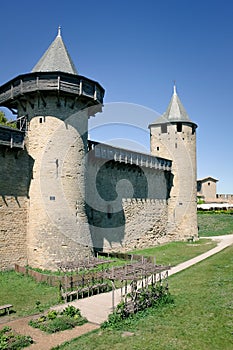 France, Carcassonne- AUGUST 28, 2014. Powerful fortifications and bastions of Carcassonne Castle. Beautiful conical blue roofs of