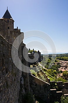 France, Carcassonneâ€” AUGUST 28, 2014. Powerful fortifications and bastions of Carcassonne Castle. Beautiful conical blue roofs
