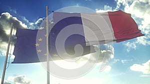 France and European Union flags waving on the wind. The European Union and The French Republic