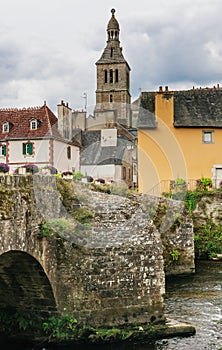 France, Finistere, Quimperle, view of old Bridge Le Pont Lovignon over Elle river and the church Sainte Croix photo