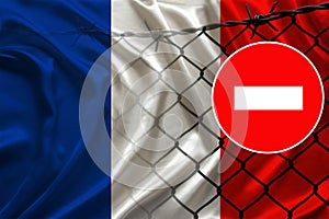France flag on satin, fence with barbed wire, symbolic red sign no entry, entry prohibited, travel restrictions across European