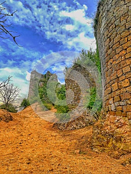 France, Indre, Berry Medieval stone castle with tower and fortification, ruins under renovation during a walk.