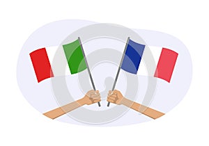 France and Italy flags. Italian and French national symbols. Hand holding waving flag. Vector illustration