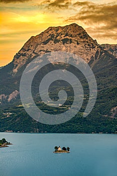 France. Lake Serre-PonÃ§on. Bay Saint-Michel and the Saint-Michel chapel with a view of the Peak of Grand Morgon