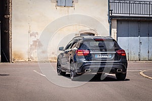 France Lyon 2019-06-20 closeup back luxury dark blue German car hatchback premium Mercedes GLA 200 d with EU registration number