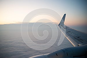 France, October 5, 2019 - Closeup of an airplane KLM wing in the sky at dawn