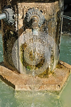 France, old fountain in Salignac photo
