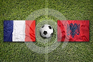 France vs. Albania flags on soccer field