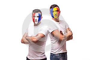 France vs Romania on white background. Football fans of Romania and France national teams look at camera