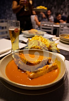 The `Francesinha Especial` is a typical and very famous Portuguese sandwich, this one was made in Braga. photo