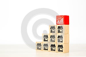 Franchise or franchising, Cube wooden toy block stack in pyramid with franchises business store icon for small business goal to