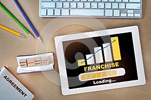 Franchise marketing business growth graph on computer digital tablet on desk