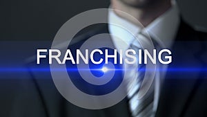 Franchising, businessman in official suit touching screen, commercial branch